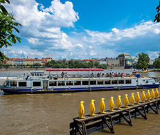 A view of a boat and the National Theatre