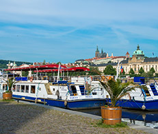 A view of Prague Castle and boats